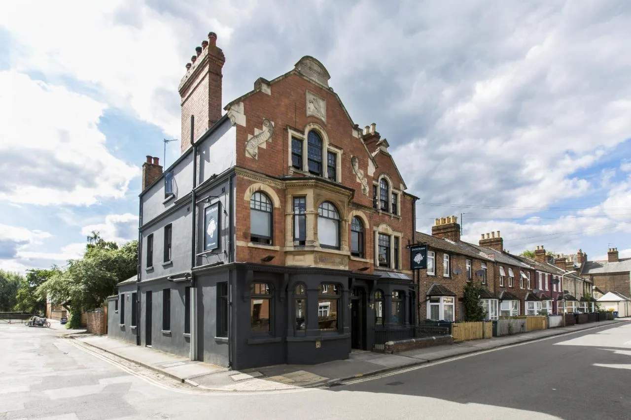 an old brick building on the side of a street at The Porterhouse Grill and Rooms in Oxford